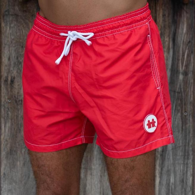 Syd & Rex Solid Rock men's premium swim trunks in Red — front view, made from SeaQual ocean plastic