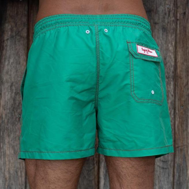 Syd & Rex Solid Rock men's swim trunks in Green — back view showing print detail