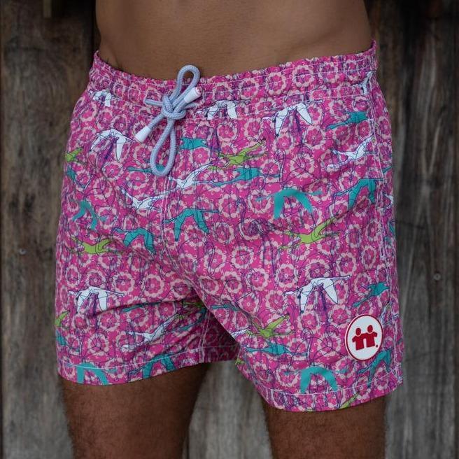 Syd & Rex Birds of a Feather men's premium swim trunks in Pink — front view, made from SeaQual ocean plastic