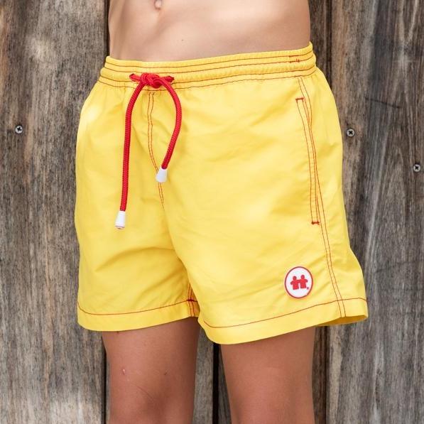 Syd & Rex Solid Rock boys' premium swim trunks in Yellow — front view, made from SeaQual ocean plastic