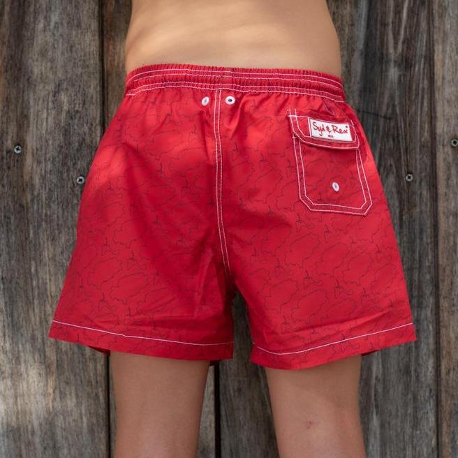Syd & Rex Island Lines boys' swim trunks in Red/Blue — back view showing print detail