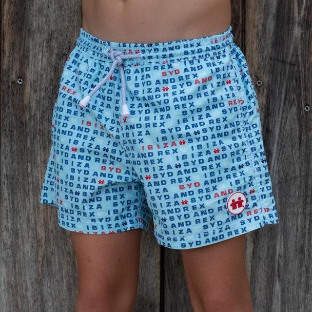 Syd & Rex Words boys' premium swim trunks in Sky — front view, made from SeaQual ocean plastic
