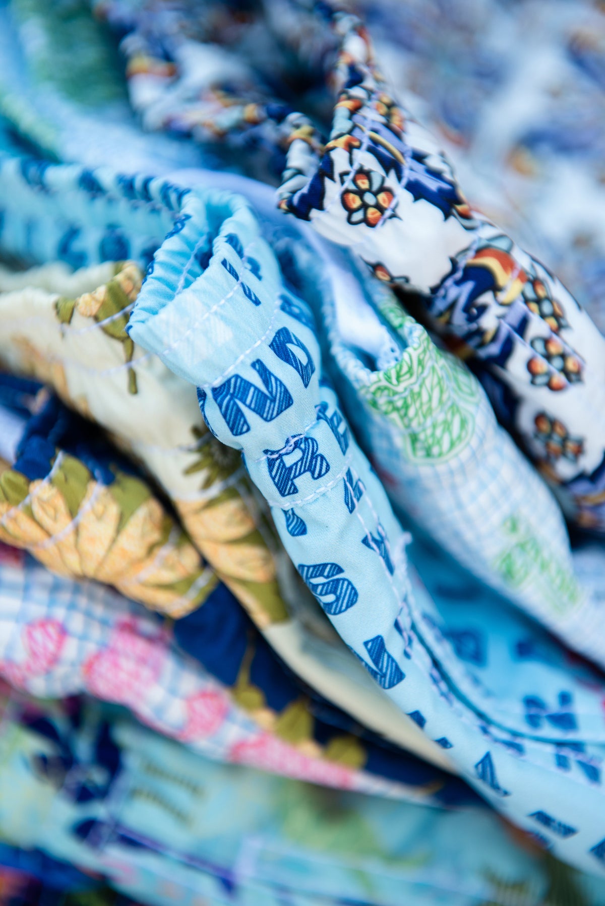 Syd & Rex swim trunk print detail — the hidden Ibiza stories behind the designs