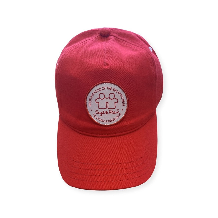 Syd & Rex trucker cap — front view with embroidered logo